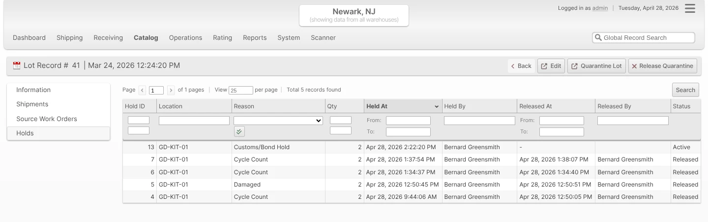 Holds tab on a Lot view page listing every Location currently or previously quarantined for the Lot, with Hold ID, Location, Reason, Qty, Held At, Held By, Released At, Released By, and Status