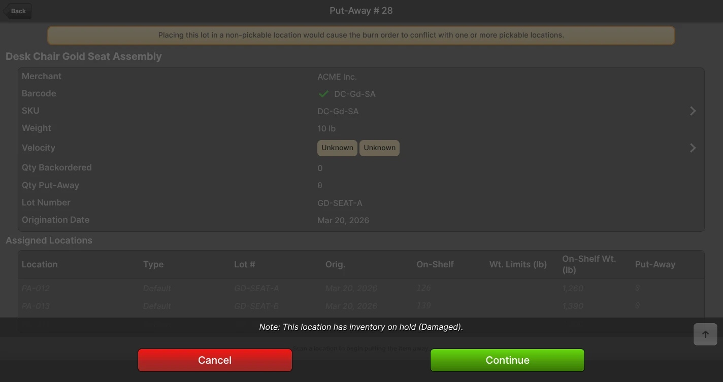 Scanner Put-Away page with a "Note: This location has inventory on hold (Damaged)." banner shown when putting away into a destination that already carries a hold