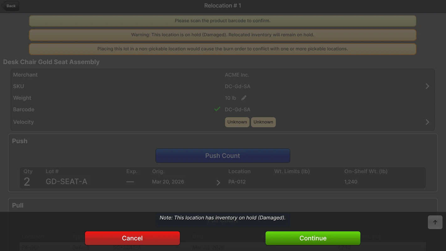 Scanner Relocation page on a held source Location with a "Warning: This location is on hold (Damaged). Relocated inventory will remain on hold." banner and a "Note: This location has inventory on hold (Damaged)." confirm dialog with Cancel/Continue