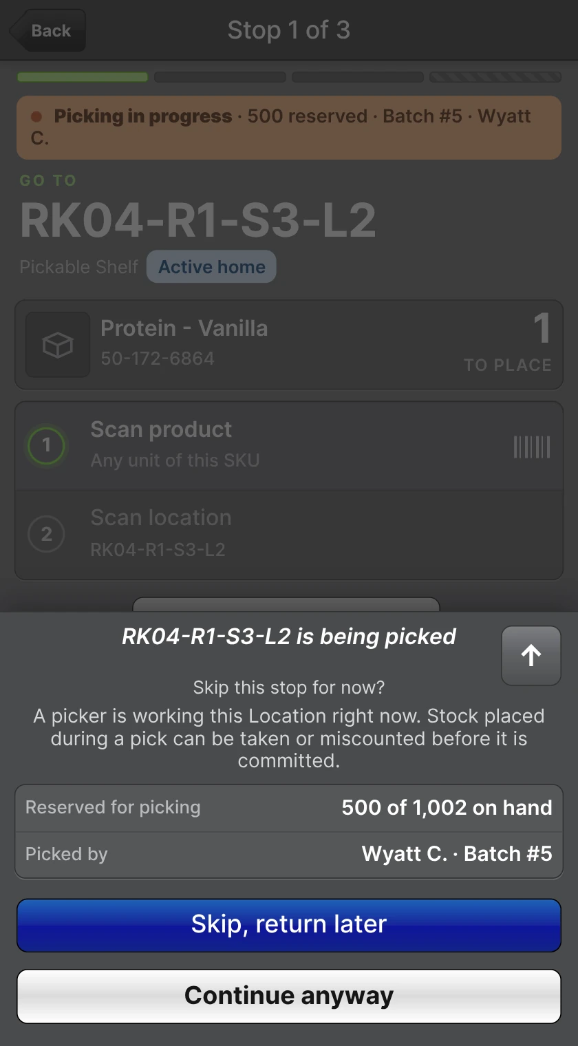 Directed Put-Away stop with the Picking in progress banner and a sheet offering Skip, return later or Continue anyway